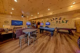 Cabin game room with pool table, air hockey game