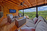 Fire pit and TV outside on 6 bedroom cabin deck