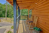 Family cabin with front porch rocking chairs