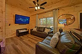 Cabin game room with sleeper sofa and Arcades