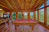 Cabin rental with pool table and race car game 