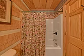 2 bedroom bathroom with a shower/tub combo