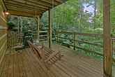 2 bedroom cabin deck area with a swing