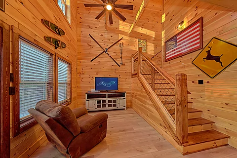 Living Room with Smart TV and Recliner - Firefly Ridge