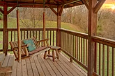 2 bedroom cabin with porch swing and hot tub