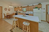 Fully Equipped Kitchen with Extra Seating at Bar
