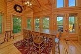 Cabin dining room overlooking a mountain view