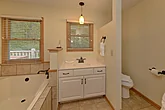 Large private bathroom  with a jetted tub