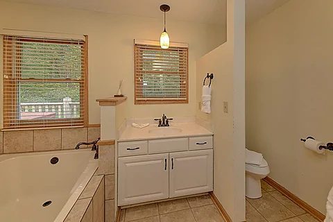 Large private bathroom  with a jetted tub - Misty Cove