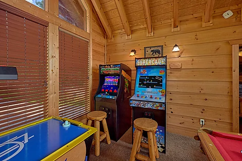 Arcade games and pool table in cabin game room - Mountain Bearadise