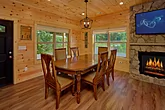 Dining room with fireplace in 3 bedroom cabin 