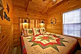 Cabin with King bedroom and log headboard