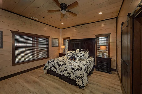 Main Level Master Bedroom in 15 bedroom cabin - Smoky Mountain Masterpiece