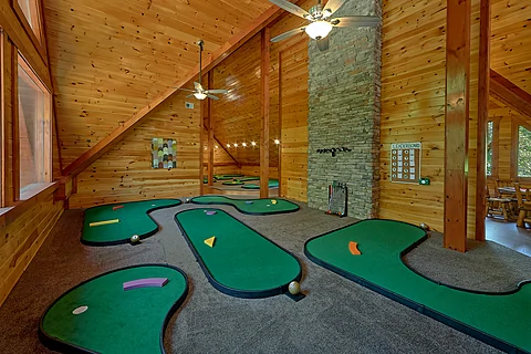 Luxury cabin rental with indoor putt putt course - The Big Lebowski