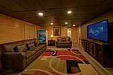 Cabin game room with sleeper sofa and Fridge